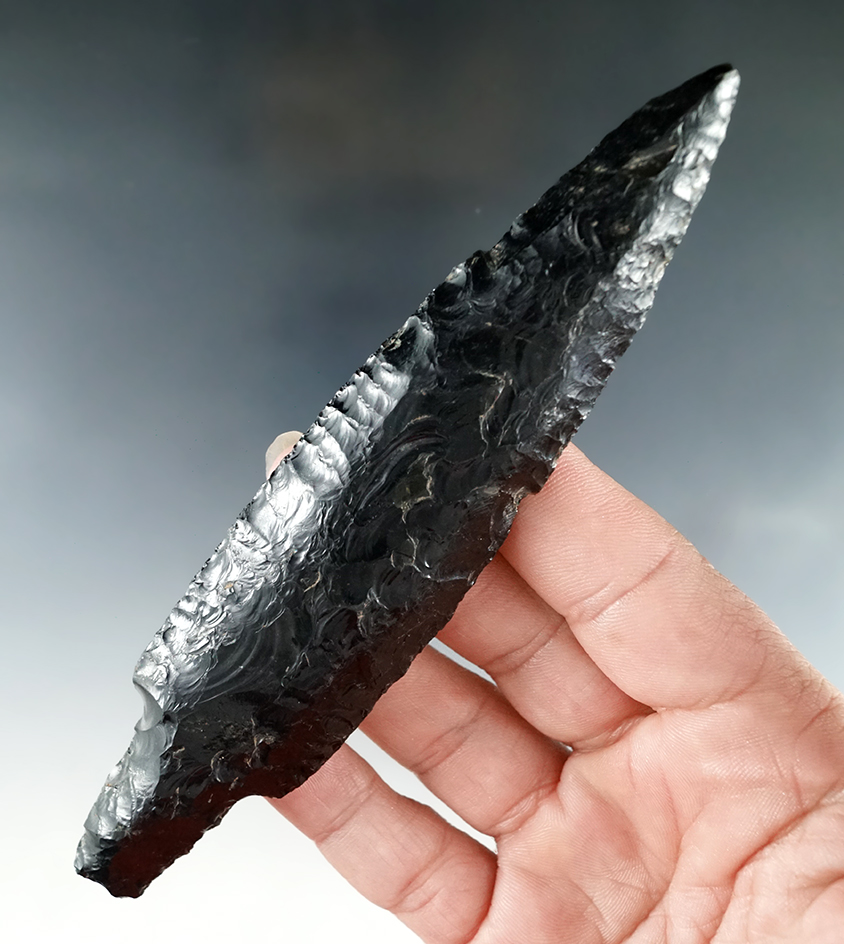 Exceptional flaking on this 5 3/8"  Pre-Columbian obsidian Stemmed Blade found in West Mexico.