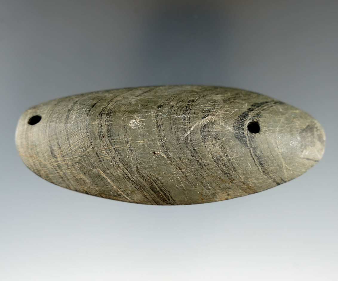 3 7/8" Humped Gorget made from banded slate. Found in southern Michigan.
