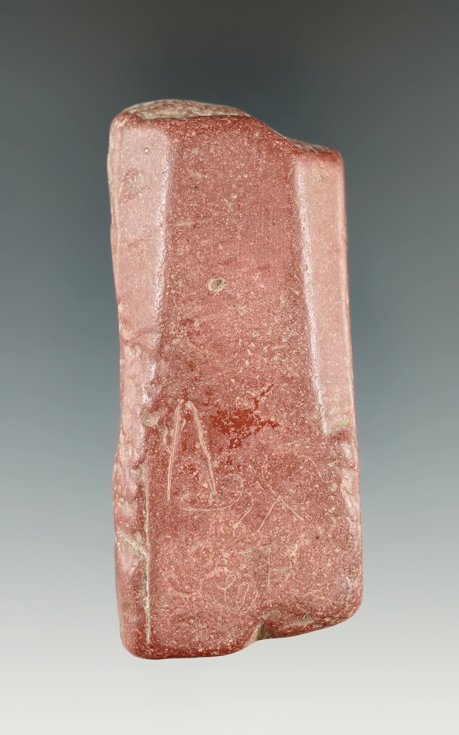3" Section of worked Catlinite that has incised lines, punctate marks and a V-shaped etch.