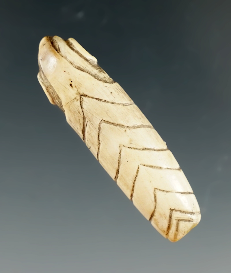 1 5/8" Bone Alaskan Carving. Comes with a Bennett COA.