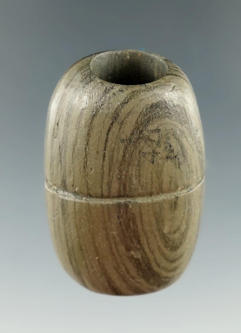 1 1/2" miniature drilled and grooved Bannerstone that is one half restored found in Ohio.