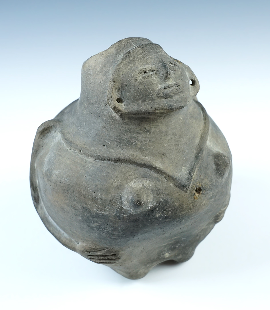 5 3/8" Seated Human Effigy Hooded Bottle found in Arkansas. Ex. Ira Amos collection. 