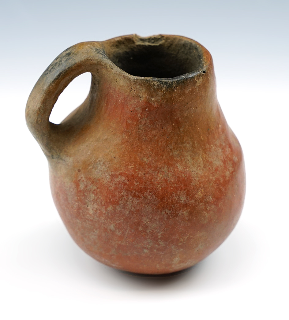 3 3/8" miniature Prehistoric handled pitcher in solid condition found in New Mexico.
