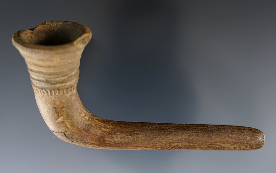 4 1/4" Iroquois Clay Trumpet Pipe with nice ring design found in New York. Restoration to the stem.