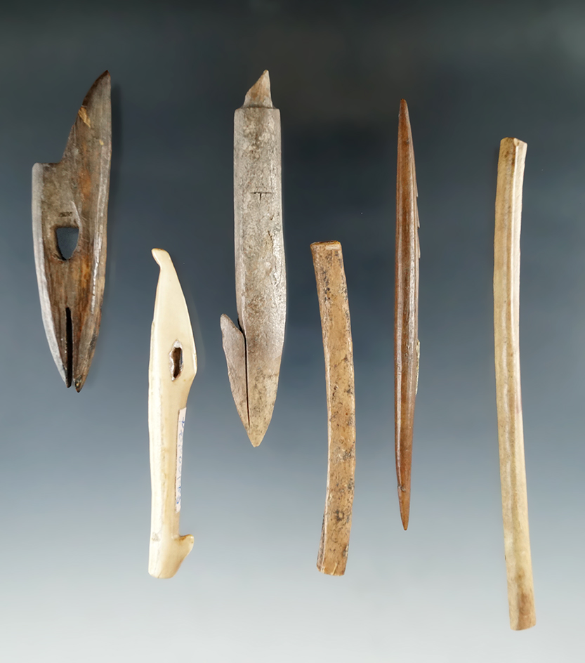 Set of six assorted bone artifacts found in Alaska, largest is a 4 3/4" bone tube bead.