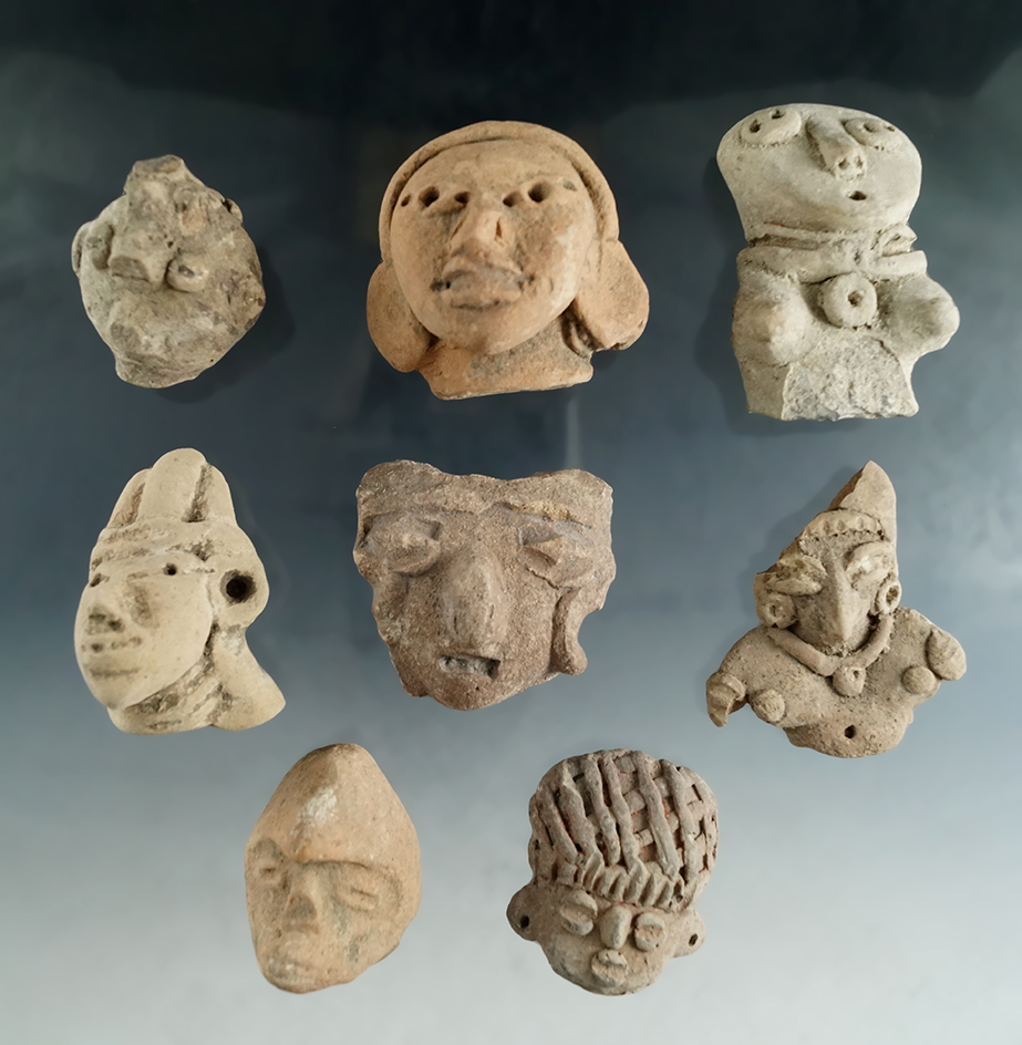 Set of eight assorted pre-Columbian pottery heads found in Mexico.
