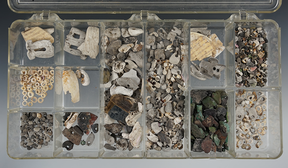 Selection of assorted drilled stone, shell and turquoise beads found at a site in New Mexico.