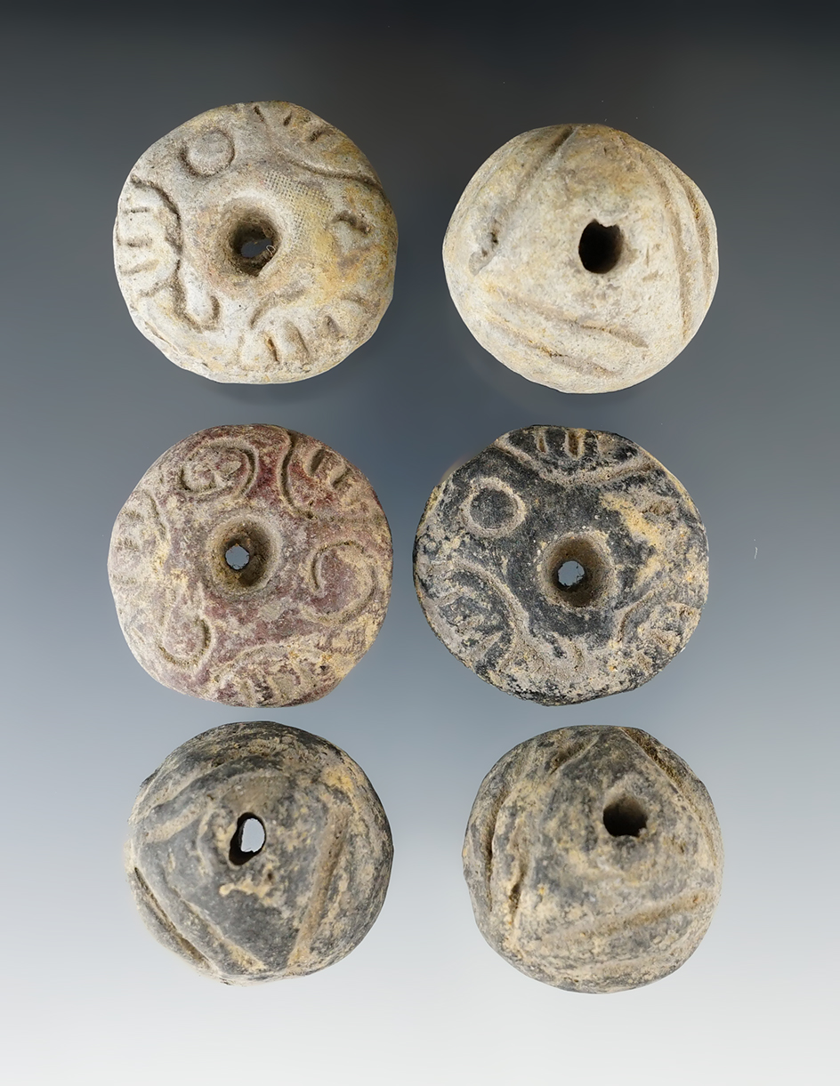 Set of six nicely styled Precolumbian clay beads found in Mexico. Largest is 1 1/4" diameter.