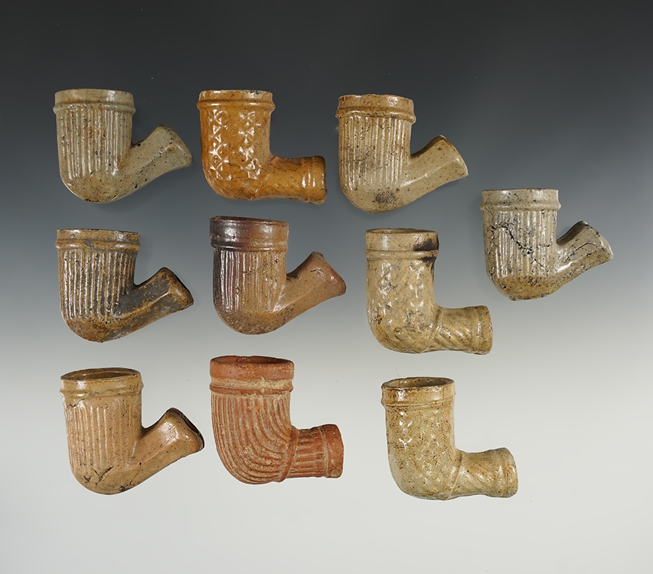 Set of ten clay trade pipes.