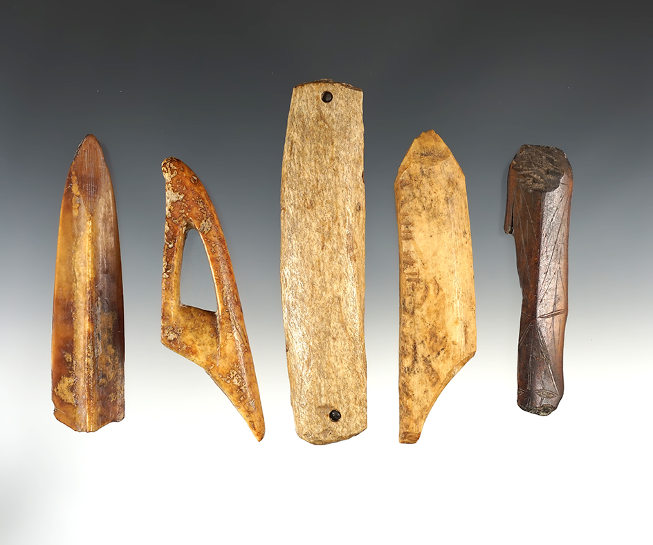 Set of five assorted bone and ivory artifacts found in Alaska, largest is 5 5/16".