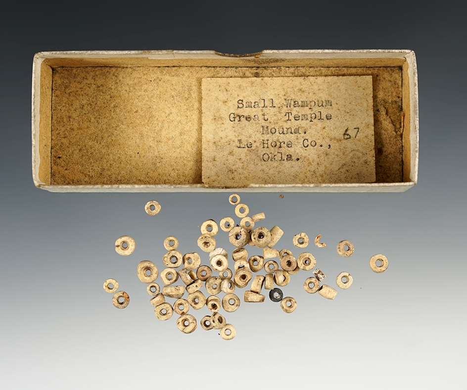 Group of small drilled shell beads.  Tag in box states they are from LaFlore Co., Oklahoma.