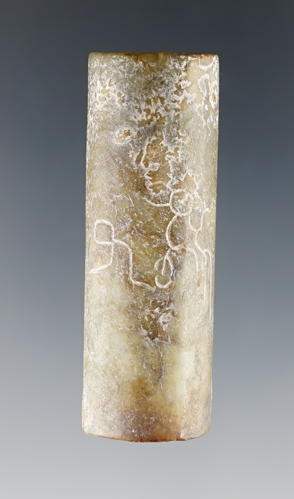 1 15/16" Bead with abstract human figures. Southeastern Asia. Ex. Clem Collins, L. L. Dees.