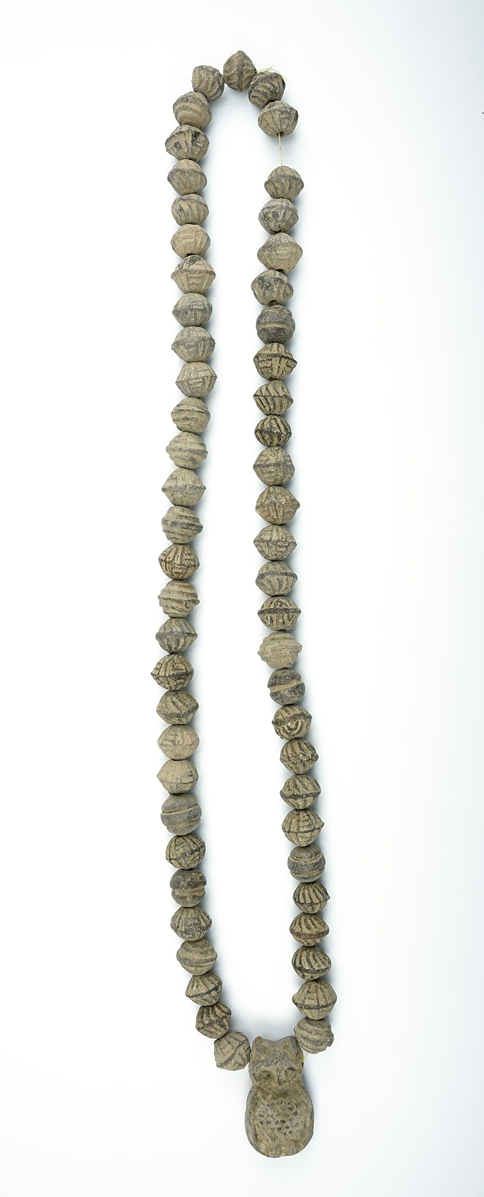 28" Strand of Pre-Columbian clay beads found in Mexico. Includes a nicely crafted owl effigy