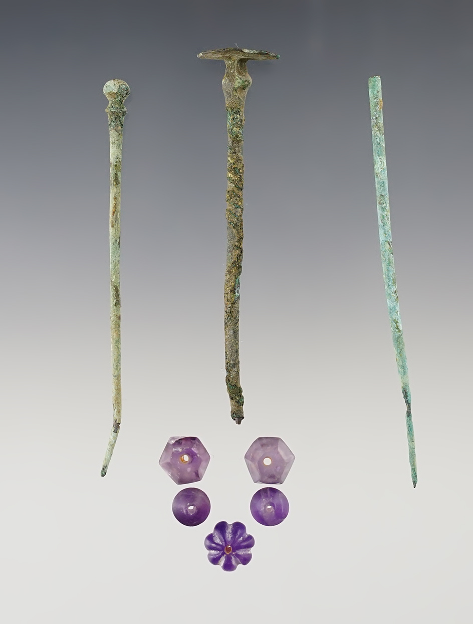 Set of Roman artifacts including five Amethyst Beads and three Metal Pins. Largest is 3 3/16".