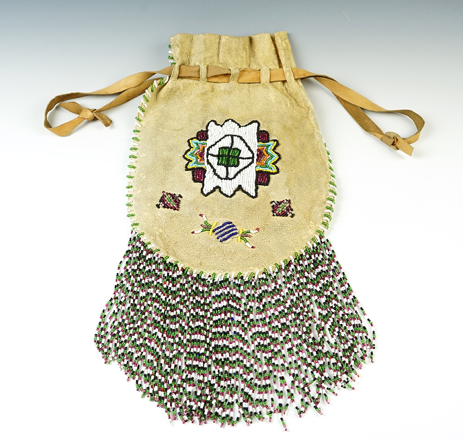 Beautiful beadwork on this 11 1/2" long x 8" wide vintage Leather Pouch. Mid 1900's.