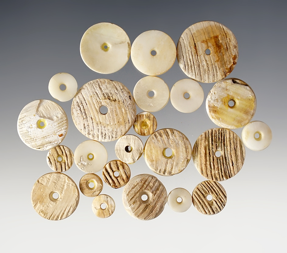 Group of 23 Drilled Shell Beads recovered in Colusa Co., California. Largest is 7/8" diameter.