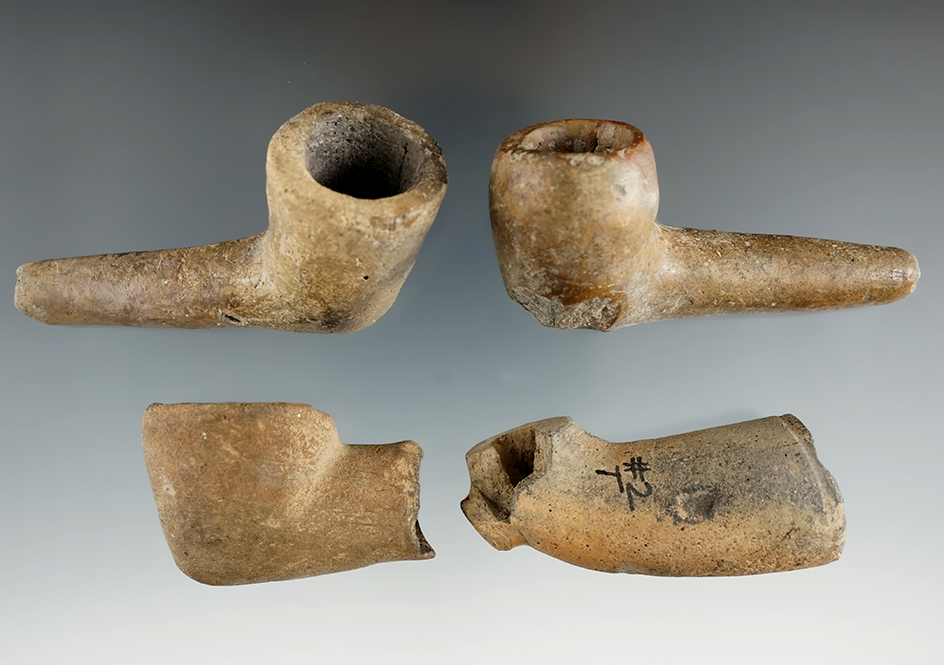 Four Iroquois pipes with some damage and some restoration. Largest is 3 1/8". Found in New York.