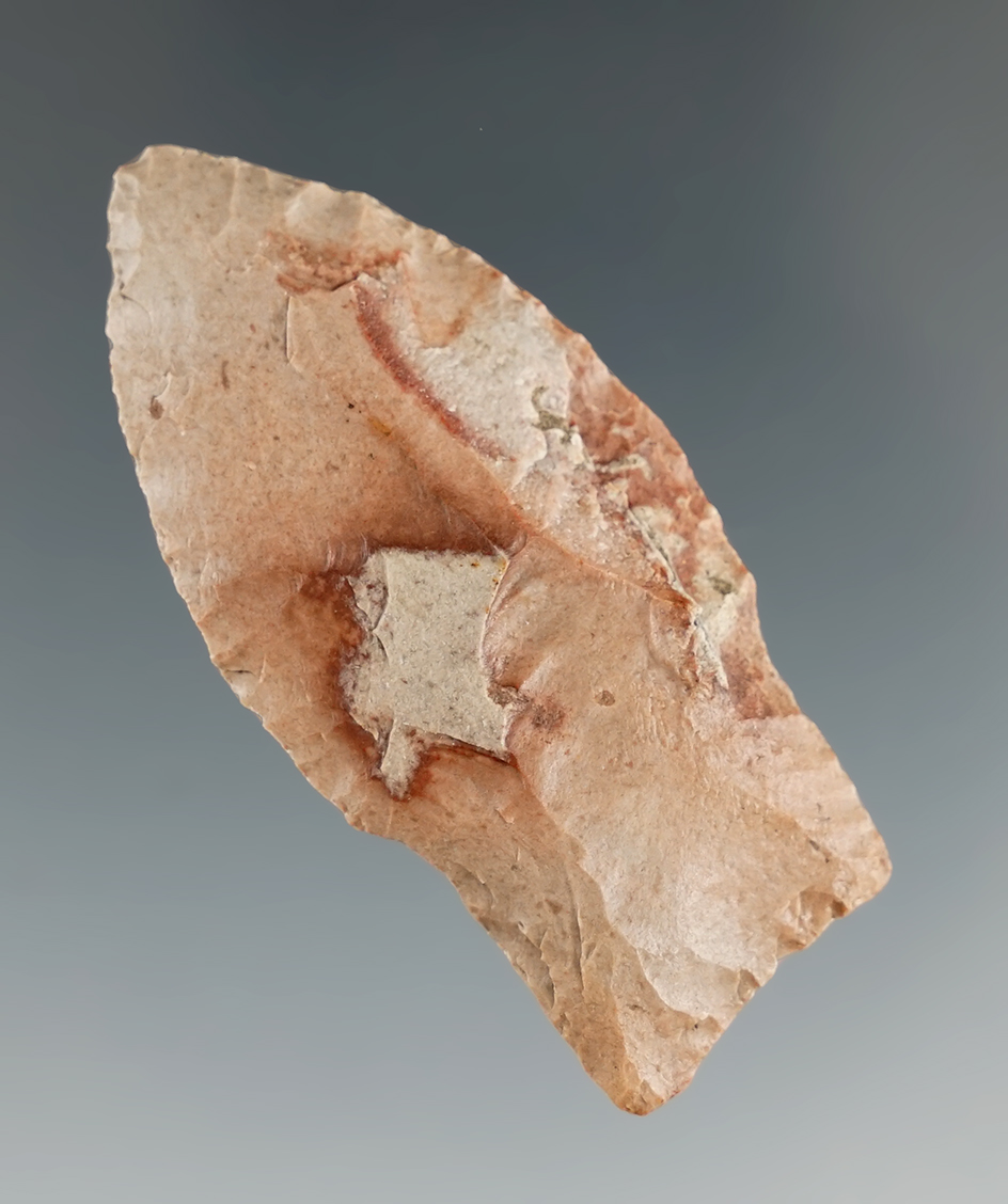 2 1/8" Paleo Hell Gap with a flute on one side and a nicely ground stem area. Eastern South Dakota.