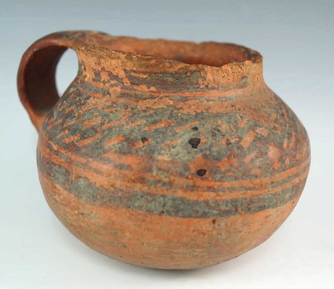 5 1/2" long southwestern black on red handled cup - solid with a few rim chips. 4 corners region.