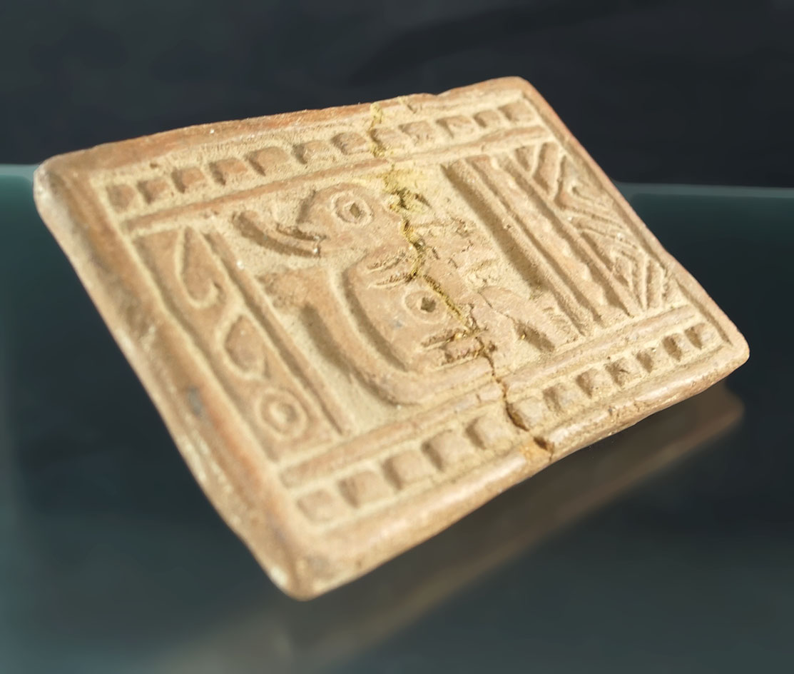 5 1/16" Mayan pottery stamp for ancient fabrics which is broken and glued but still interesting.