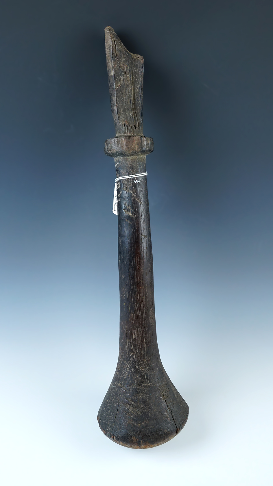 Very old 17 1/4" long Island Culture Poi Pounder made from wood that is heavily patinated. 