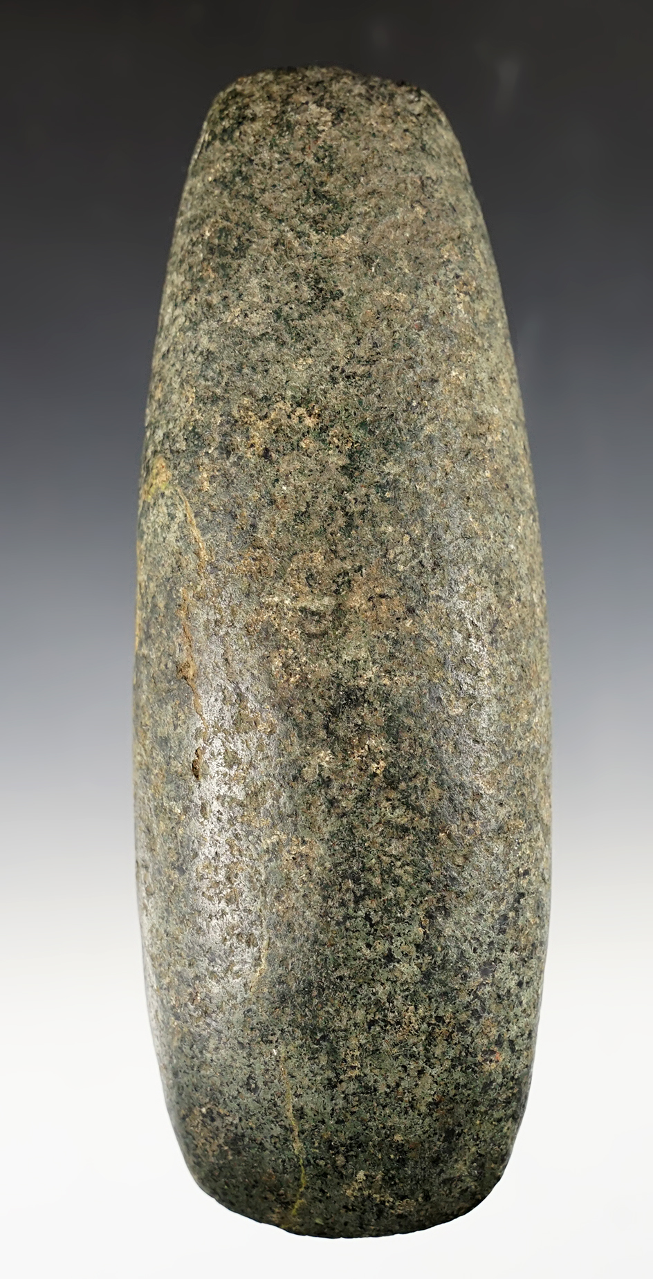 Well patinated 7 1/8" Pole Celt found in Licking Co., Ohio. Slight ancient damage, displays well. 