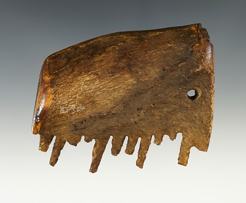 3 3/4" Bone Comb found in a cave in Independence Co., Arkansas. Heavily patinated.