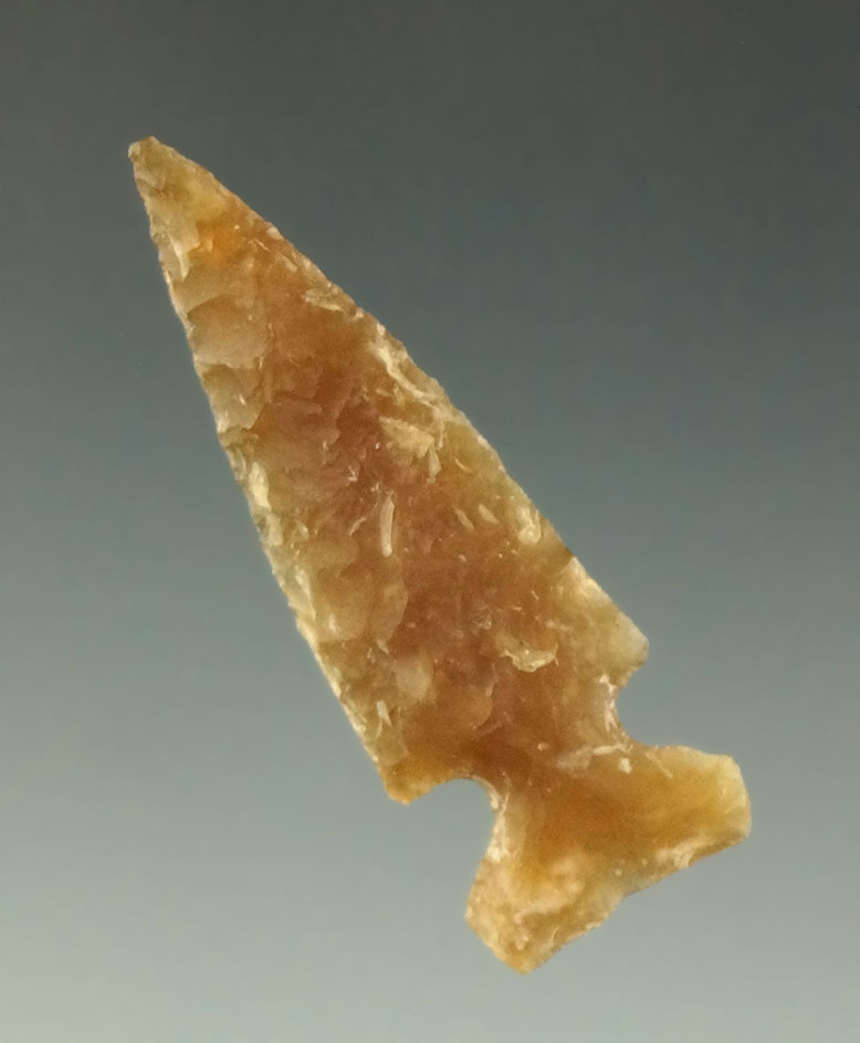 Nice flaking and style on this 1 7/16" Knife River Flint sidenotch arrowhead found in the Dakotas.