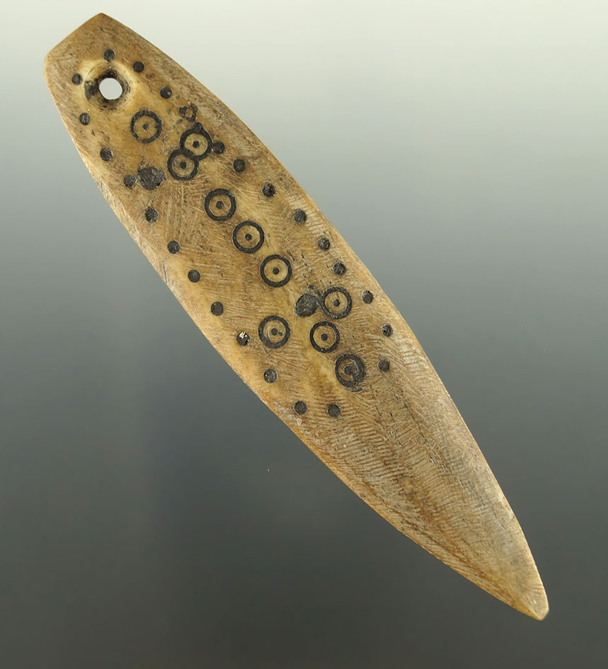 Highly engraved 3 11/16" bone pendant found in Alaska.