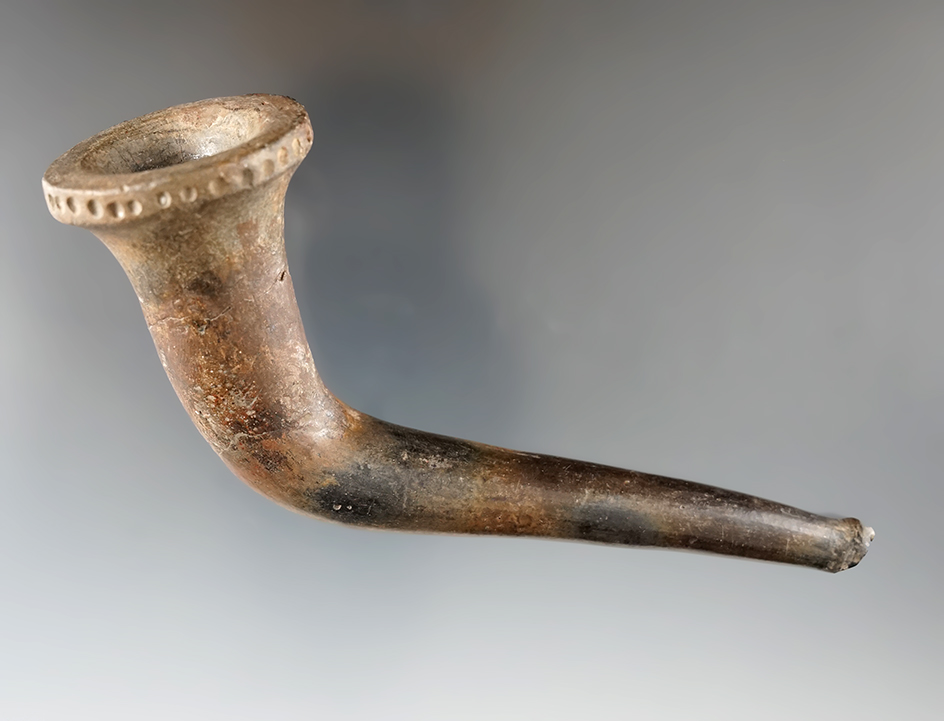 5" long Iroquois clay trumpet pipe with punctate design around bowl rim. Restoration.
