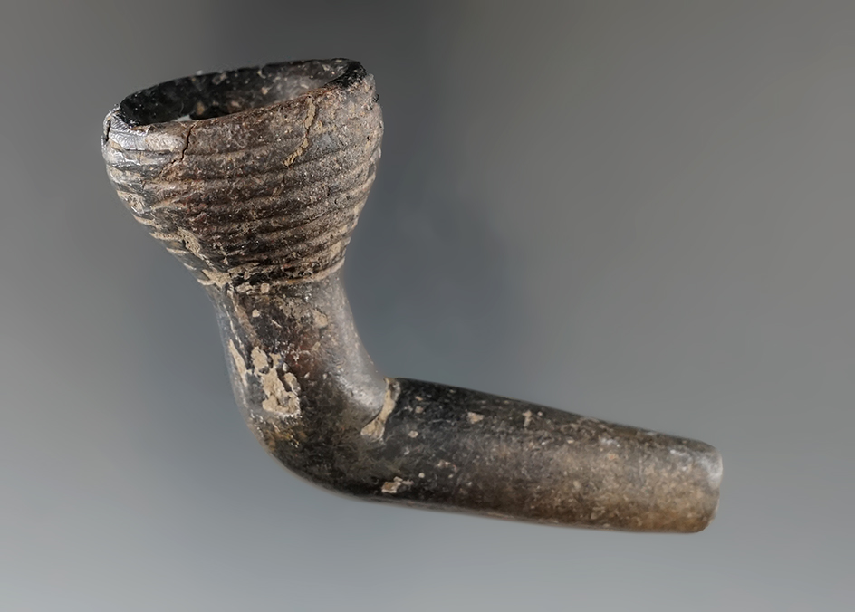 3" long ring bowl Iroquois clay pipe with partial restoration to the bowl and a mended elbow.