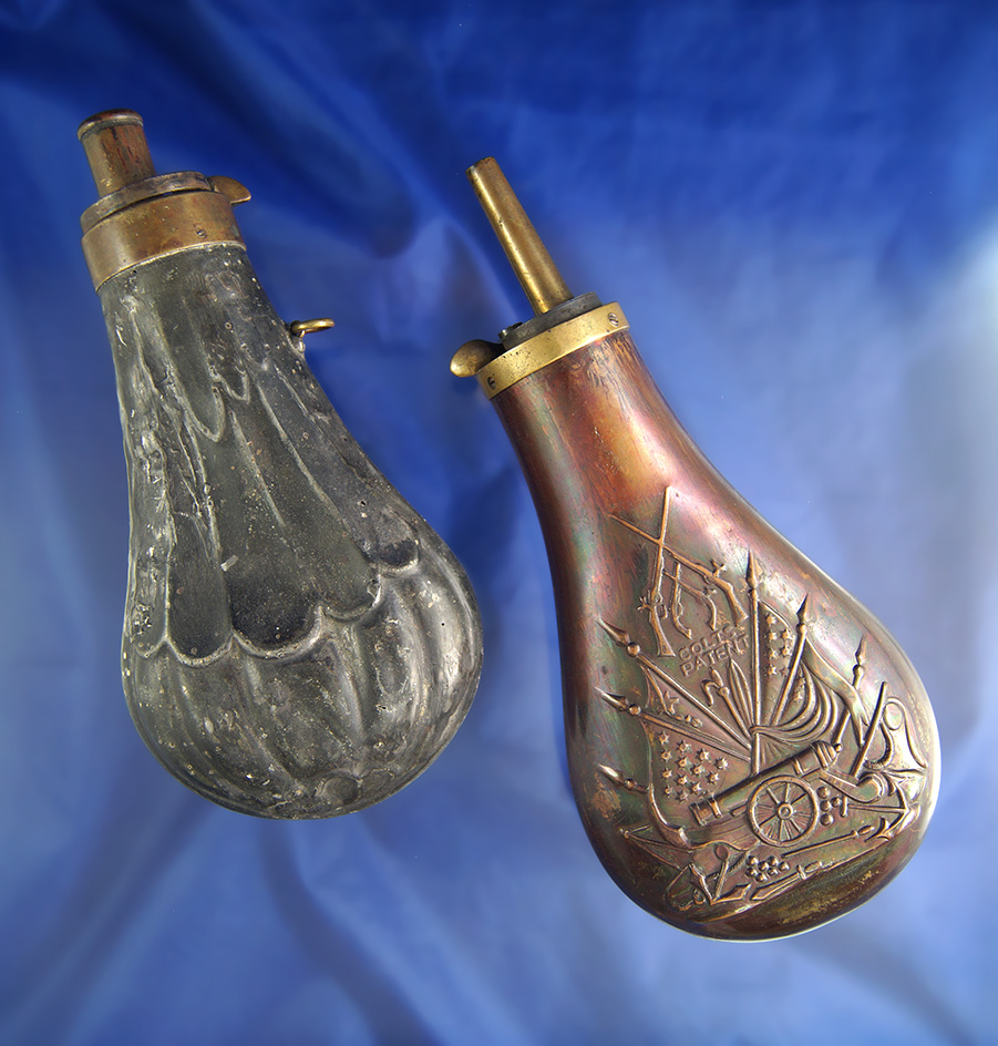 Pair of brass powder flasks, one is vintage and one is contemporary. Largest is 6 1/2" tall.