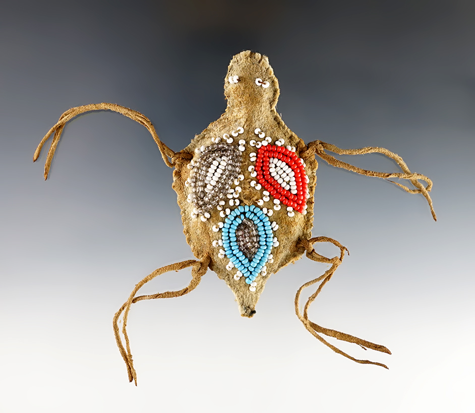 Very old 3 1/2" long nicely beaded leather fetish in excellent condition. Great display item.