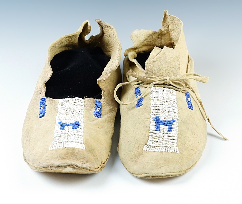 10 1/4" long nicely beaded Plains leather moccasins in decent condition. No missing beads.