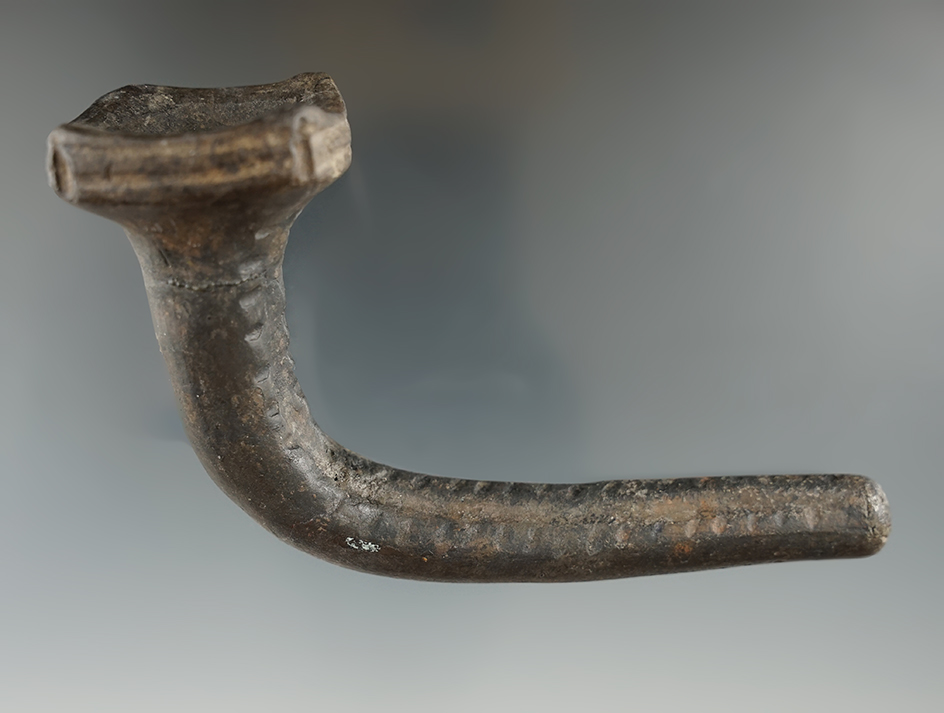 4 3/8" Huronian clay castellation with a reattached bowl and restoration to elbow/stem. NY.