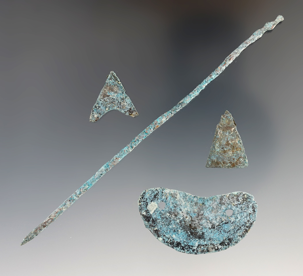 Group of metal trade items including a triangular arrowheads, miniature brass Gorget, awl