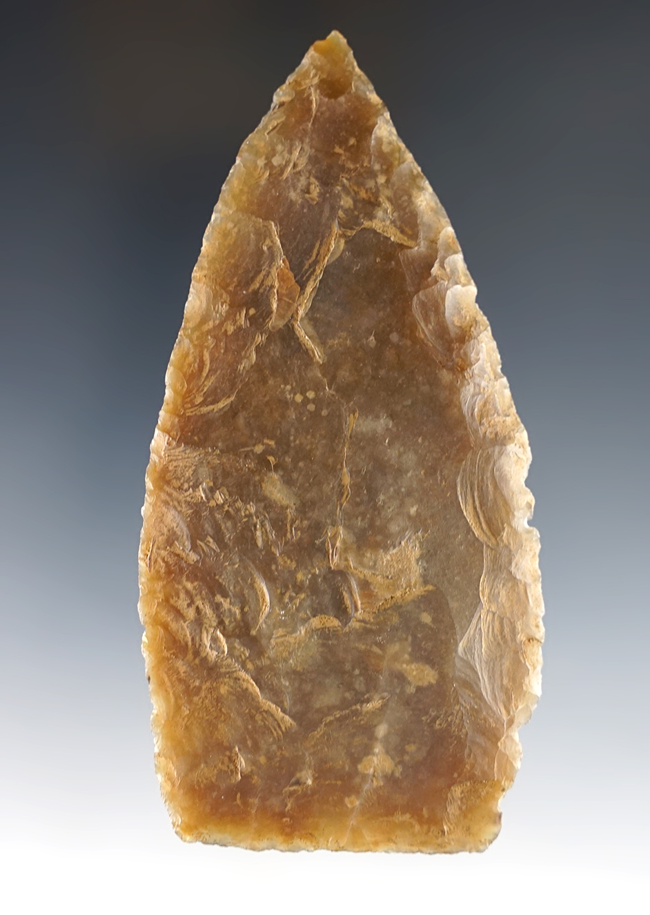 Well patinated 4 1/8" Texas Knife made from semi-translucent flint.