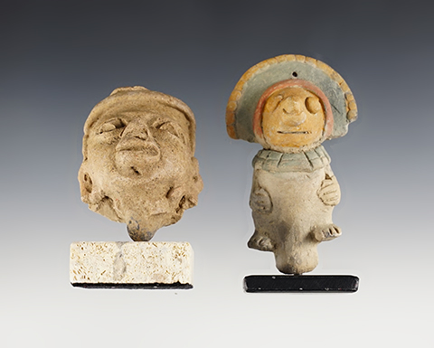 Pair of nicely made Pottery Heads. The largest is 3 1/2".