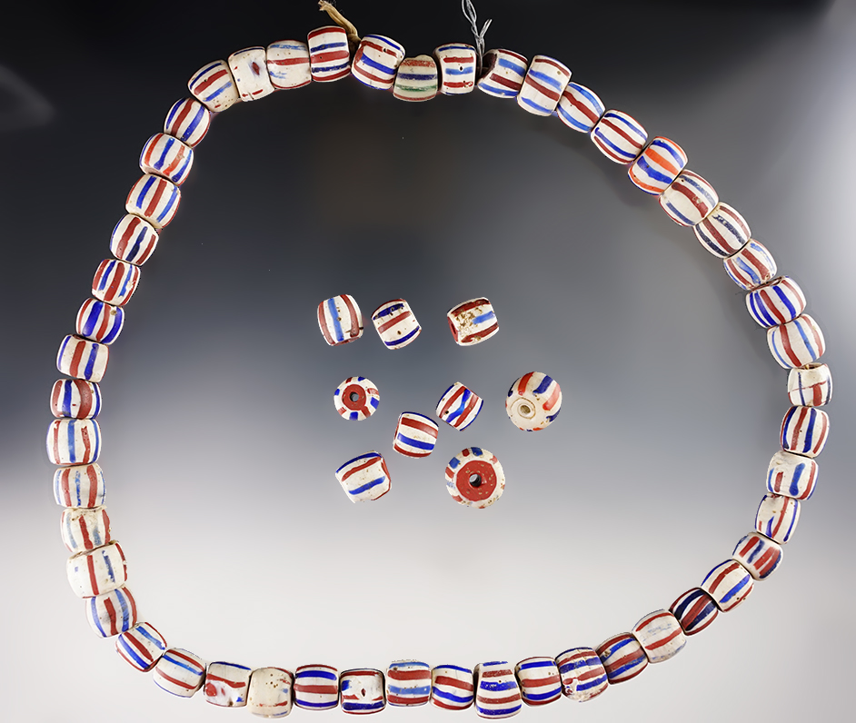 24" strand consisting of 50 early candy stripe Dutch beads as well as 9 single beads. 