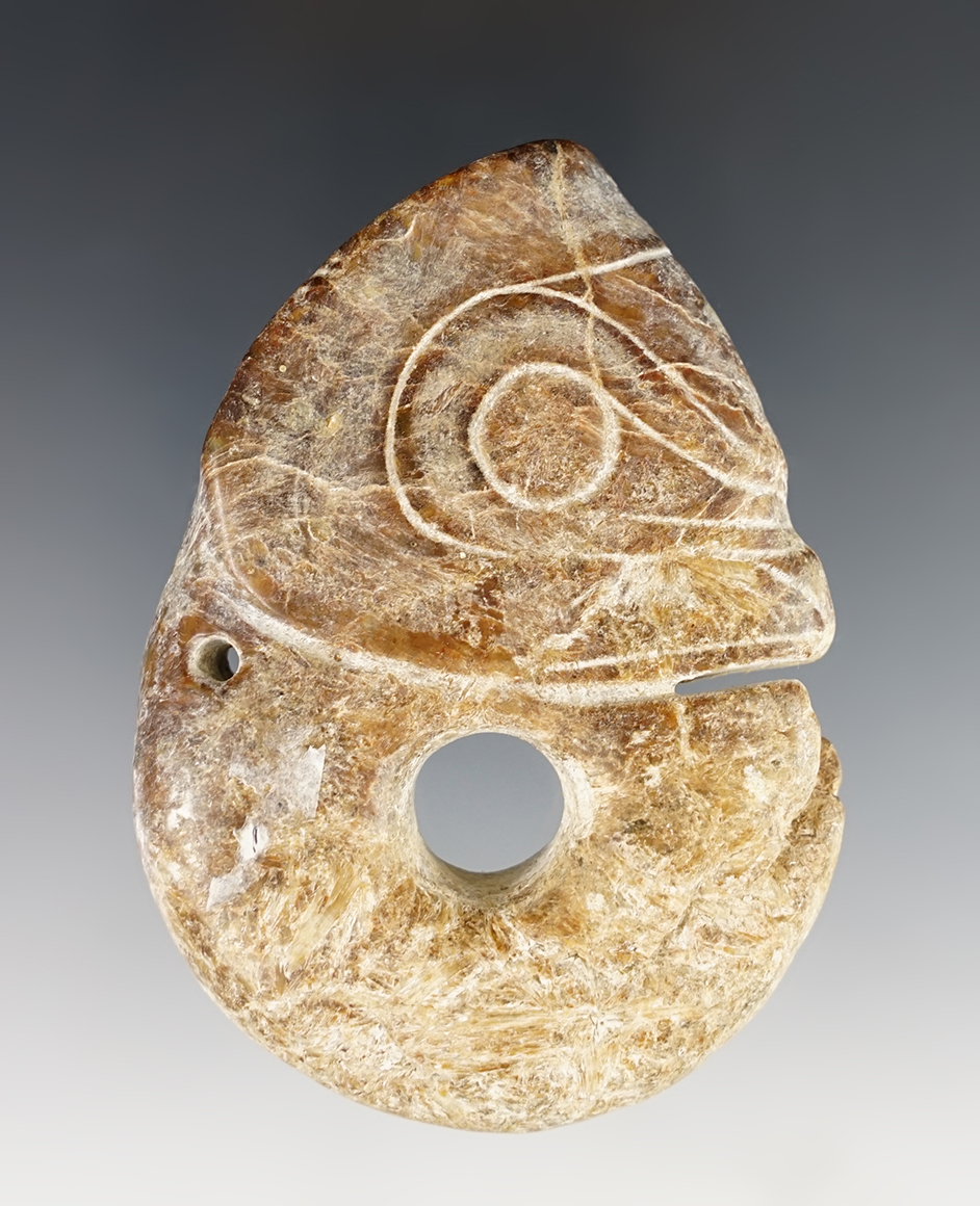 3 1/4" monster effigy with a drilled large perforation pendant found in Southeast Asia.