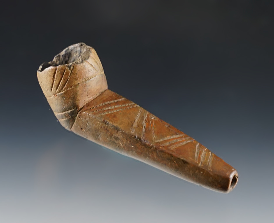 3 3/8" Beautifully styled clay pipe recovered in New York. Nice design on exterior.