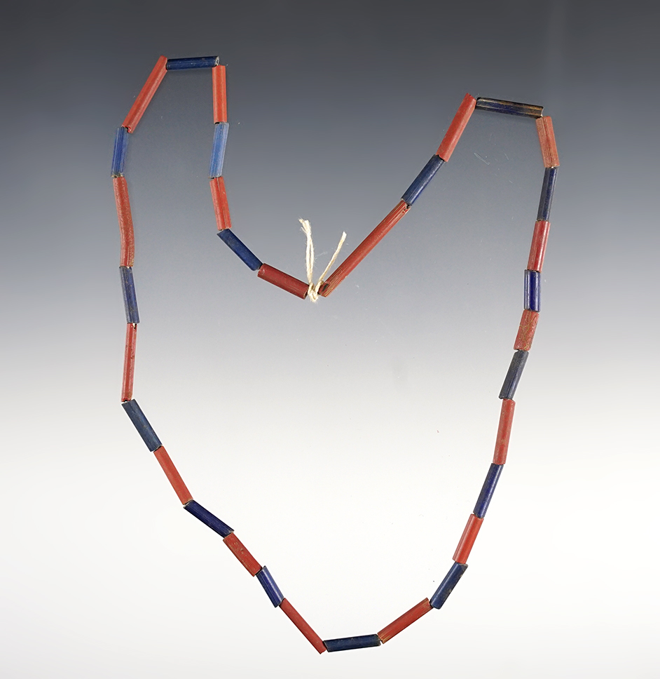 17" Strand of red and blue tubular beads. Recovered at the Dann Site in Lima, Monroe Co., NY.