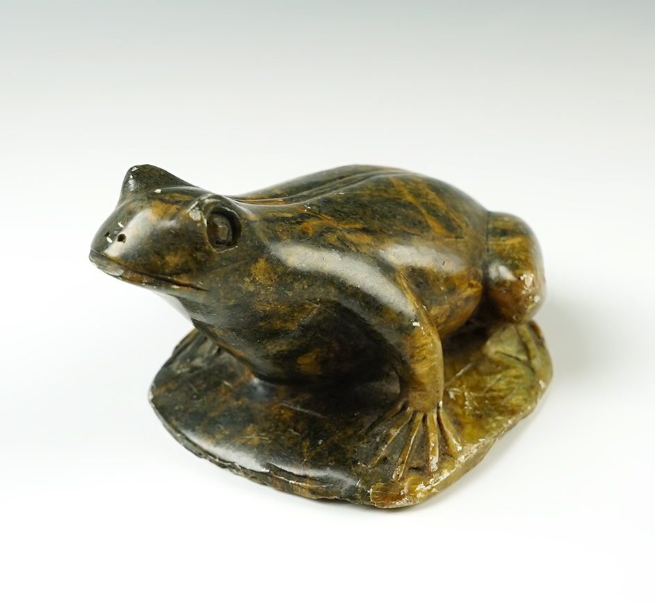 4 1/2" long x 3" wide beautiful stone carving depicting a frog, signed on bottom by artist. 