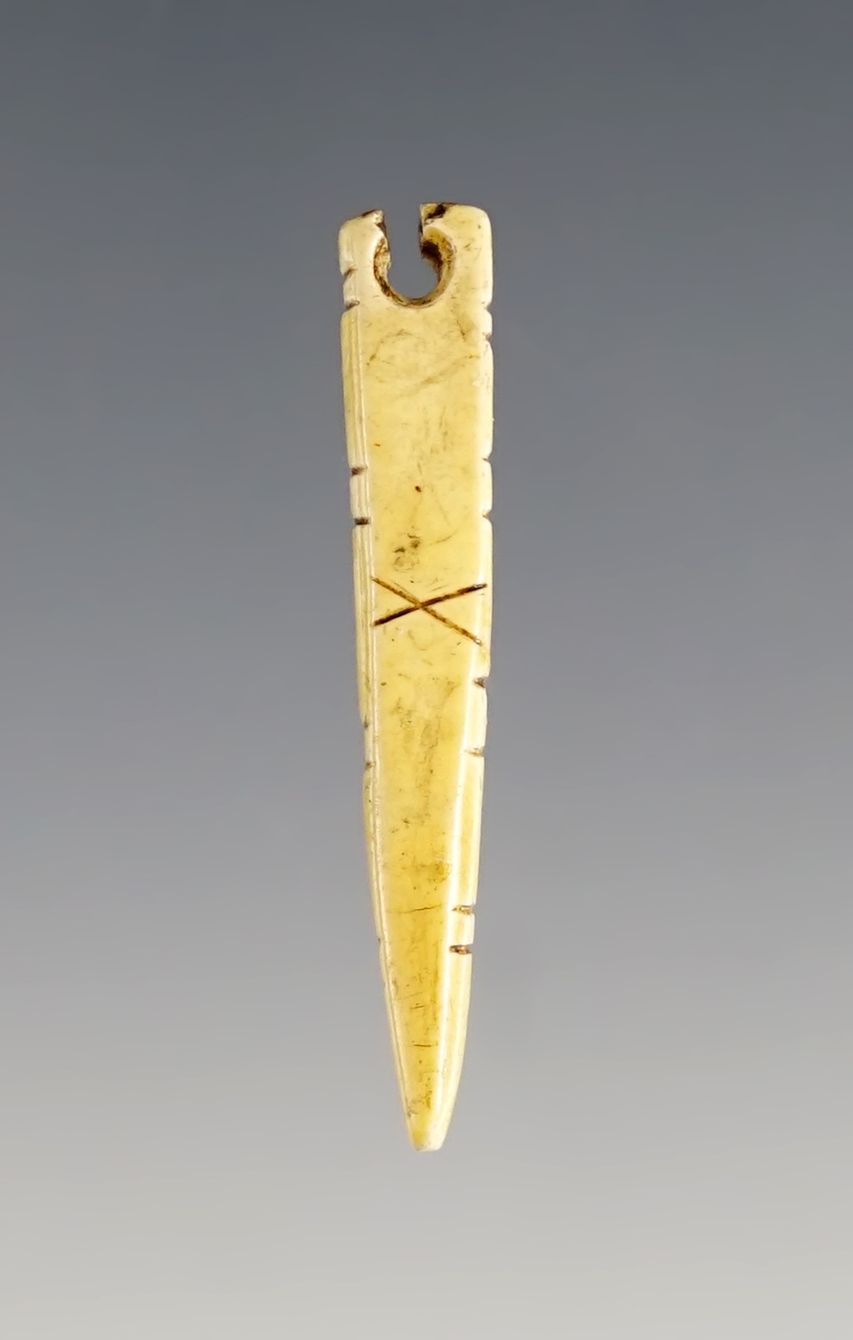 1 7/16" drilled and engraved Bone Pendant. Found at the Fox Field Site in Mason Co., Kentucky.