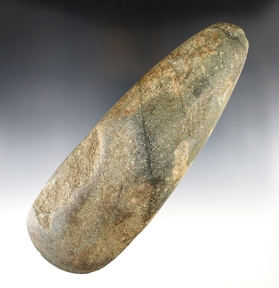 Large 7 13/16" Stone Celt that is well patinated with a nice bit. Found near Dayton, Tennessee.