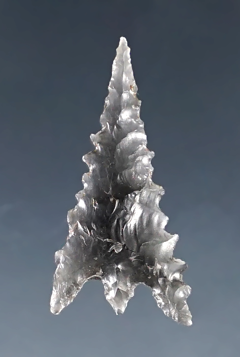 15/16" beautifully pin stem point. Excellent flaking. Found in southern Oregon.