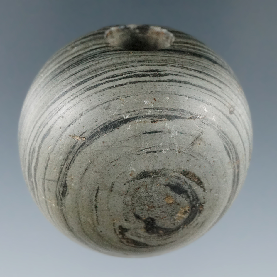 1 5/8" Archaic Fluted Ball Bannerstone made from green and black Banded Slate, found in Ohio.