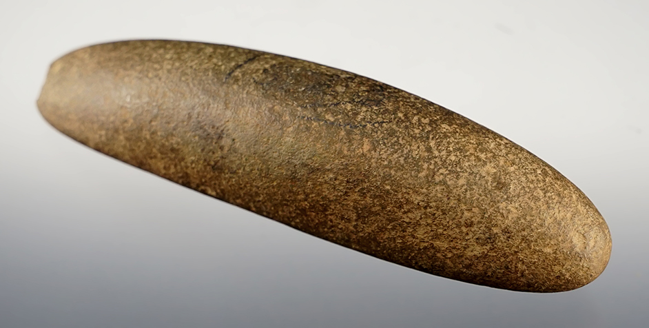 4 3/8" long Atlatl Bar Weight found in Indiana. Made from patinated Hardstone.