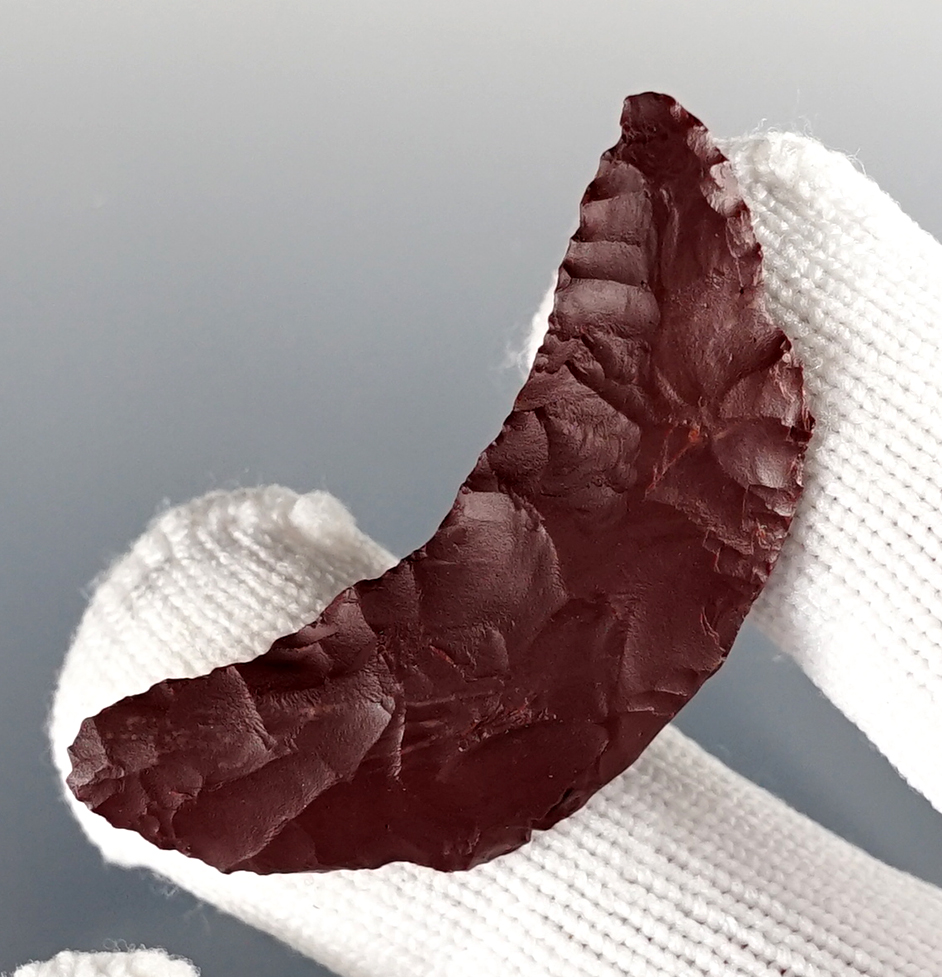 1 11/16" Paleo Crescent found in Lake Co., Oregon. Made from patinated Jasper. Bennett COA.