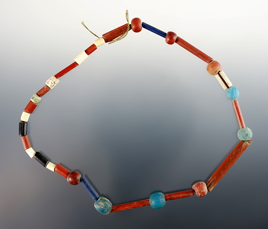 12" Strand of Beads consisting of small Catlinite, Tubular and "Dutch" Blues. Found in New York.